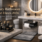 Luxury bathroom decor must haves 2026 featuring modern black and gold accessories LED mirror and spa style bathroom setup